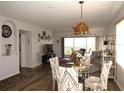 Bright dining area with glass table and patterned chairs at 2180 Heron Lake Dr # K-208, Punta Gorda, FL 33983