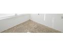 Unfinished room with concrete floors and white walls at 230 Waterway Ne Cir, Port Charlotte, FL 33952