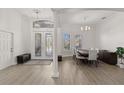 Bright dining area with hardwood floors and elegant chandelier at 2408 Silver Palm Rd, North Port, FL 34288