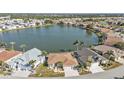 Community overview showcasing lakefront property and homes at 24424 Buckingham Way, Punta Gorda, FL 33980