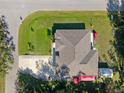 Housetop view showcasing roofline and backyard space at 3008 Yeadon Ter, North Port, FL 34286