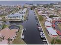 Aerial view of waterfront community with boat docks and canal at 311 Garvin St # 411B, Punta Gorda, FL 33950