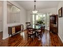 Bright dining room with hardwood floors and built-in hutch at 3341 Briant St, North Port, FL 34287