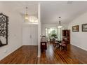 Bright dining room with hardwood floors and built-in hutch at 3341 Briant St, North Port, FL 34287