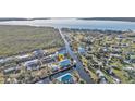 Aerial view showcasing a home's waterfront location and surrounding neighborhood at 4297 Nettle Rd, Port Charlotte, FL 33953