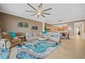 Bright living room with sectional sofa, large windows, and water views at 95 N Marion Ct # 233, Punta Gorda, FL 33950