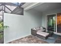Covered patio with wicker furniture and view of the backyard at 17764 Palmetto Pass Ln, Punta Gorda, FL 33982