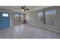 Bright living room featuring tile floors and a modern electric fireplace at 20037 Sancraft Ave, Port Charlotte, FL 33954
