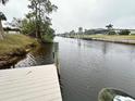 Private dock on a tranquil waterway at 2474 Como St, Port Charlotte, FL 33948