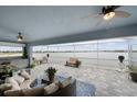 Spacious covered lanai overlooking a lake, outdoor furniture at 27 Meadowlark Ln, Placida, FL 33946