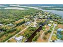 Aerial view of property, highlighting its canal-front location at 28434 Sabal Palm Dr, Punta Gorda, FL 33982