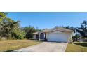 One-story house with a spacious yard and a two-car garage at 4330 Shappell St, Port Charlotte, FL 33948