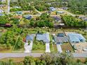 Bird's-eye view showcasing a single-Gathering home with pool and canal access at 472 Eppinger Dr, Port Charlotte, FL 33953