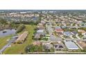 Community view showcasing numerous houses and green spaces at 5608 New Covington Dr, Sarasota, FL 34233