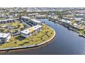 Condo building sits on a waterfront lot with lush green landscaping at 601 Shreve St # 35C, Punta Gorda, FL 33950