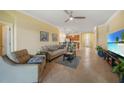 Living room, view of kitchen and access to backyard at 6049 Grand Cypress Blvd, North Port, FL 34287