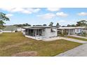 Aerial view of a white mobile home with screened porch at 6305 Parkview Ct, North Port, FL 34287