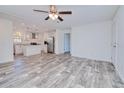 Open concept living room and kitchen with wood-look flooring at 6720 Villaview Dr, Punta Gorda, FL 33982