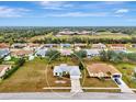 Bird's eye view of a single-story home in a residential neighborhood at 13284 Buckett Cir, Port Charlotte, FL 33981