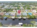 Aerial view showcasing home's location on a canal with neighborhood context at 18305 Wolbrette Cir, Port Charlotte, FL 33948