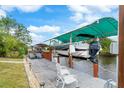 Private boat dock with lift and seating area, perfect for waterfront living at 18305 Wolbrette Cir, Port Charlotte, FL 33948