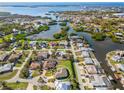 Aerial view showcasing the home's location in a waterfront community at 1966 Trout Cir, Englewood, FL 34224