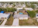 Aerial view showcasing the home's location, backyard pool, and shed at 21354 Austin Ave, Port Charlotte, FL 33952