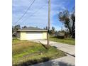 Single car detached garage with long driveway at 2430 Dixie Ave, Punta Gorda, FL 33950