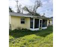 Back of the house with screened patio at 2430 Dixie Ave, Punta Gorda, FL 33950