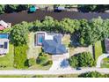 Home situated on waterfront property with a private pool at 27300 San Carlos Dr, Punta Gorda, FL 33983