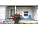 Front porch with seating and vibrant flowers at 311 Bayridge Pl, Punta Gorda, FL 33950