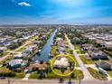 Aerial view showing a single Gathering home and surrounding canal at 3200 Colony Ct, Punta Gorda, FL 33950