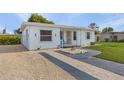 Front view of a charming house with seahorse decor at 3740 Easy St, Port Charlotte, FL 33952