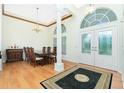 Formal dining room with hardwood floors and a chandelier at 437 Loveland Blvd, Port Charlotte, FL 33954