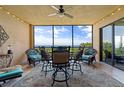 Relaxing screened-in lanai with outdoor furniture and stunning water views at 89 Vivante Blvd # 205, Punta Gorda, FL 33950