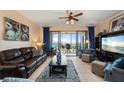 Spacious living room with water views and comfortable leather furniture at 89 Vivante Blvd # 205, Punta Gorda, FL 33950