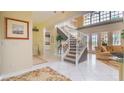 Bright and spacious entryway with elegant staircase at 9458 Snapper Cir, Port Charlotte, FL 33981