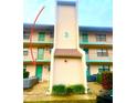Condo building exterior, featuring a light-colored facade and lush landscaping at 175 Kings Hwy # Bldg 3 314, Punta Gorda, FL 33983