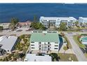 Elevated view of waterfront property, showcasing building and surroundings at 1801 Jamaica Way # 112, Punta Gorda, FL 33950