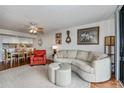 Open concept living area with adjacent dining and kitchen at 25188 Marion Ave # D205, Punta Gorda, FL 33950
