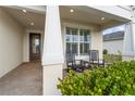 Charming front porch with rocking chairs and well manicured landscaping at 42115 Edgewater Dr, Punta Gorda, FL 33982