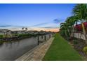 Scenic waterfront property at sunset, showcasing a private dock and canal access at 4218 Vasco St, Punta Gorda, FL 33950