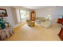 Living room with light beige carpeting and neutral decor at 951 Santa Brigida Ct, Punta Gorda, FL 33950