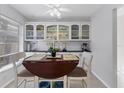 Bright eat-in kitchen with white cabinets and granite countertops at 10 Windward Ct, Placida, FL 33946