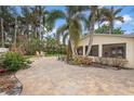 Outdoor patio with brick pavers and seating area at 110 Chasteen St, Punta Gorda, FL 33950