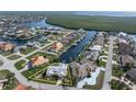 Aerial view of waterfront property, showcasing the home and surrounding canals at 1511 Casey Key Dr, Punta Gorda, FL 33950