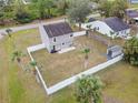 House with backyard, fenced perimeter, and palm trees at 22116 Seaton Ave, Port Charlotte, FL 33954