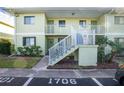 Condo building entryway with stairs and parking at 25225 Rampart Blvd # 1701, Punta Gorda, FL 33983