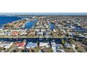 Aerial view of a waterfront community with many houses and boats at 66 Ocean Dr, Punta Gorda, FL 33950