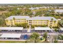 Condo building aerial view, showing parking and landscaping at 2060 Willow Hammock Cir # 302, Punta Gorda, FL 33983